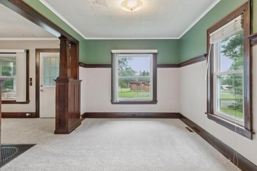 This space is the dining room and is large enough for multiple uses.