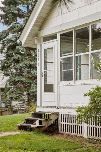 You enter the front of the home through the porch.