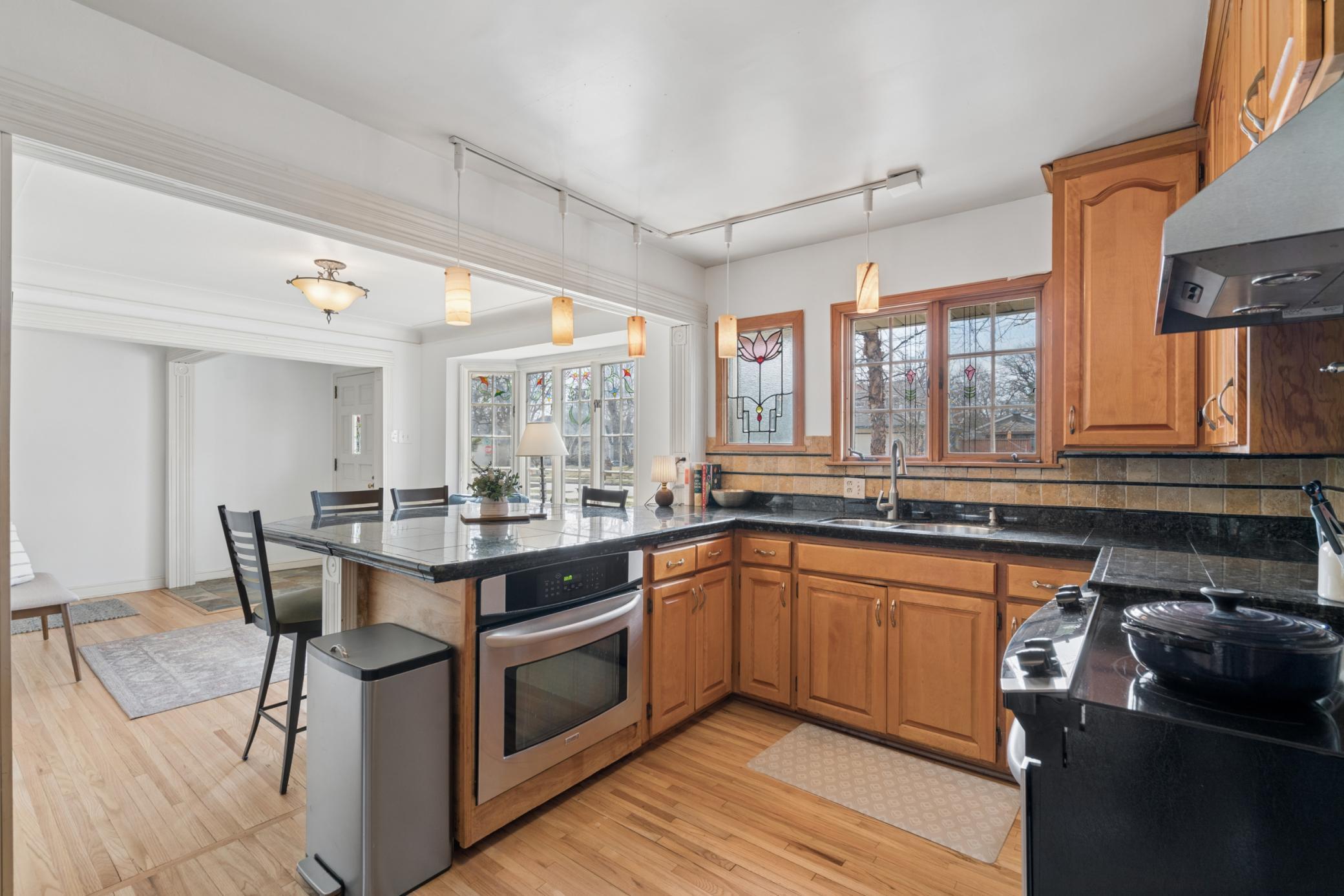 Well appointed kitchen featuring ample cabinetry, and functional workspace with views of the front yard.