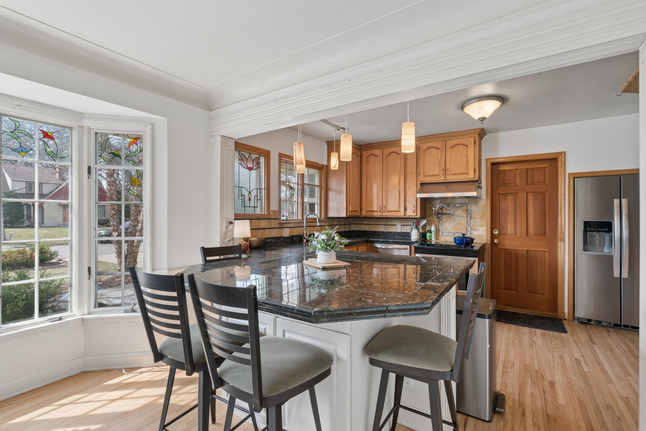 Kitchen and dining area designed for everyday living with easy flow, natural light, and access to multiple living spaces.