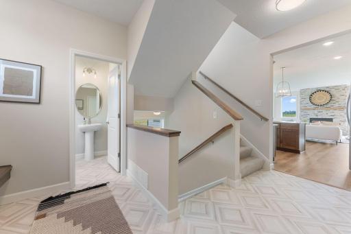 Large mudroom with unique rear stairs