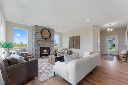 Family room gas fireplace with stone from floor to ceiling
