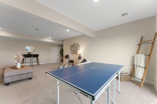 Lower level area bumps out under the dining area space above. Great space for a game table.