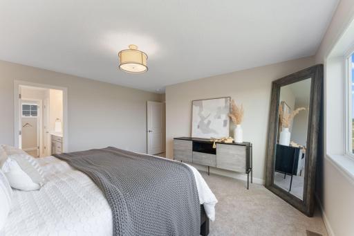 Owner's suite where you access the walk-in close through the bathroom