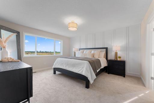 Owner's bedroom with large windows