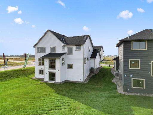 Fully sodded yard with irrigation and rock around the foundation