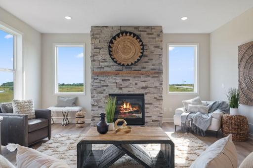 Laminate wood flooring extends into to family room for continuous flooring and more open feel