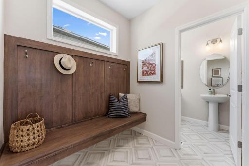 Bench open below for shoe storage or baskets and hooks across the back