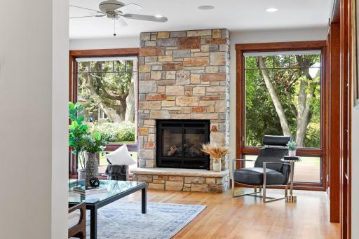 Oversized windows overlooking the lush backyard