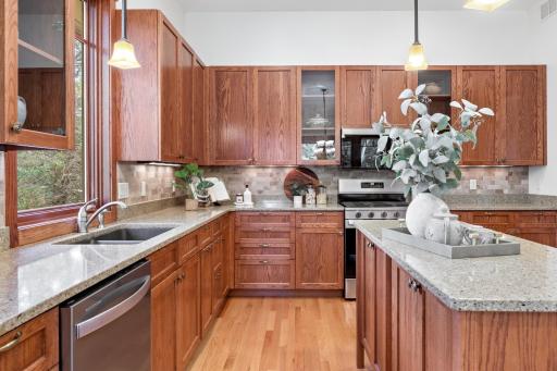 Custom cabinetry meets timeless design in a chef-inspired kitchen that anchors the heart of the home
