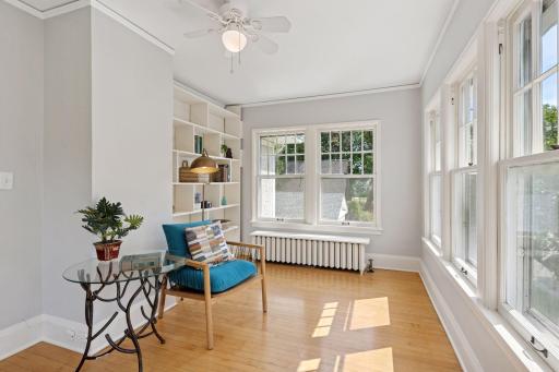 Yet another glorious sunroom, wrapped in windows, that would service well as an office
