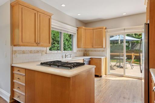 Enjoy the convenience of stepping right out to the deck and backyard from the kitchen