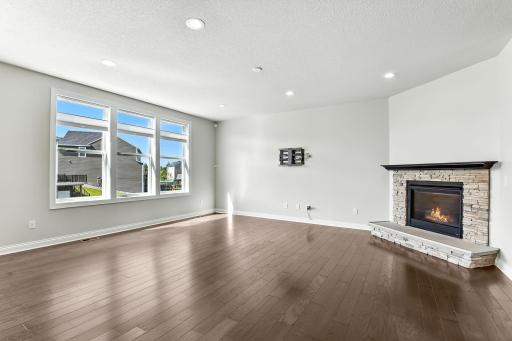 The floor has a beautiful grey undertone that comes out in cooler light while soft white light brings out the warmer tone.