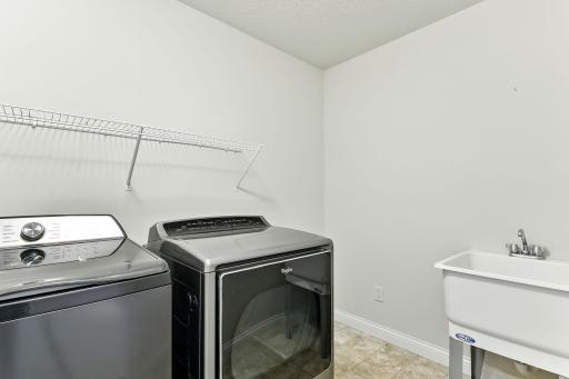 Upper level laundry with separate laundry sink & tub