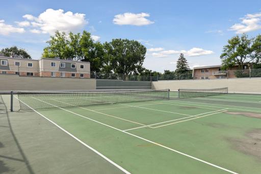 Greensboro tennis courts are adjacent to the pool and party room (association is in discussion regarding resurfacing these).