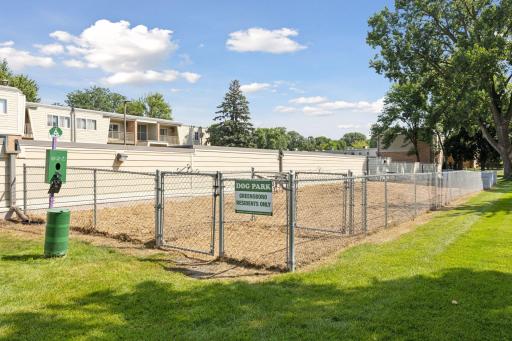 Greensboro dog park is located behind the garages on the south side of the complex.