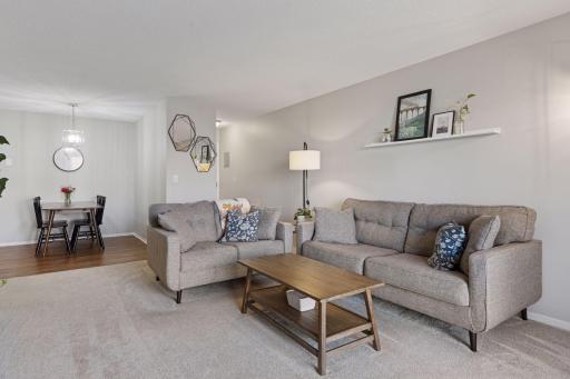 Spacious, comfortable living room with with fresh paint and updated carpeting