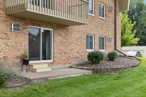 Locking sliding door opens out to ground level patio making this live like a townhome with your own outside entrance!