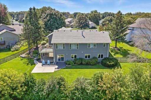 From the hedges, you can see that the drone that took this photo had to go up in the air to see into the backyard from where the photographer stood.