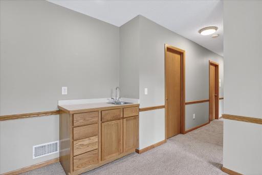 The lower level Family Room also features a great little wet bar.