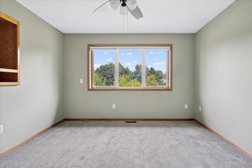 The primary bedroom features large double pane vinyl windows with great views of the back yard.