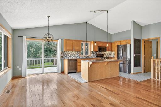 The kitchen & dining space walks directly out to the deck!