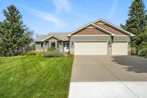 The curb appeal is stunning, including a concrete driveway, new roofing, siding and exterior lighting in 2020, and steel garage doors. And the perennials are beautiful too!