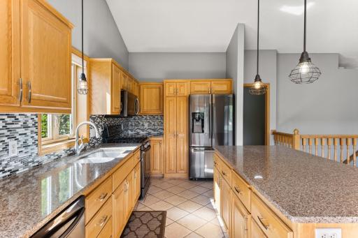 The black, white and gray backsplash shown here is actually a vinyl sticker backsplash, but does cover a tile backsplash, so you can choose which one you like better.