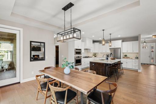 An inviting informal dining area extends off the kitchen