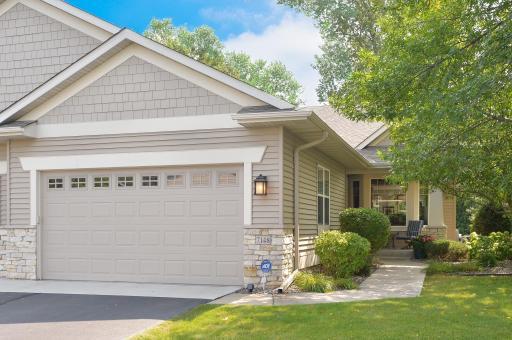 Welcoming front view includes a concrete apron