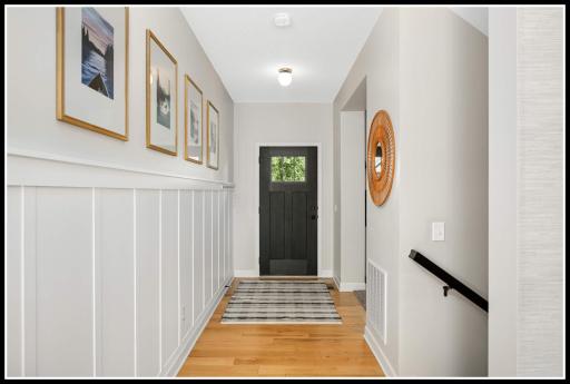 Front entry with custom board and batten wall detail