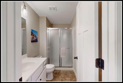 Three-quarter bathroom serves the lower level