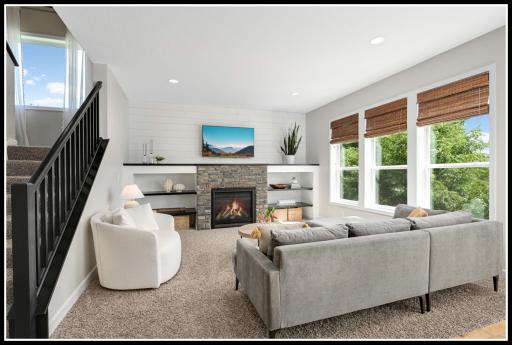 Cozy living room with stone-surround gas fireplace