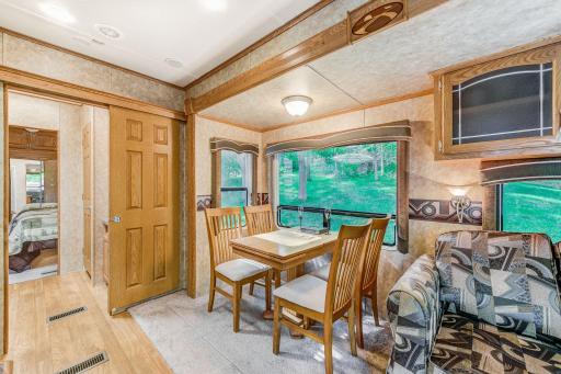 The dining table with a massive window overlooking the property is a great spot to enjoy your daily catch.