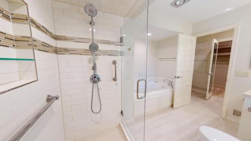 Luxury walk-in tiled shower with frameless glass doors