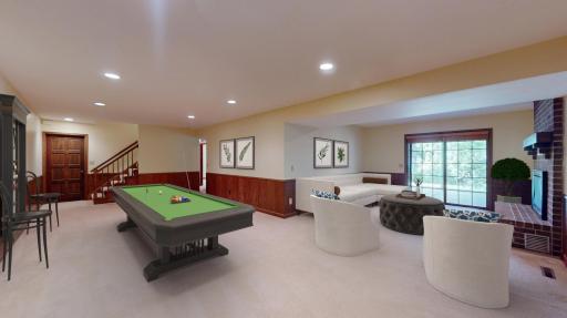 Walkout lower level with timeless wainscoting, adds warmth and durability to this perfect gathering space. virtually staged