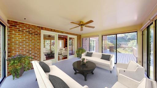 3-season porch seamlessly blends indoor comfort with outdoor living. A cozy spot to enjoy fresh air and scenic views without bugs or weather. virtually staged