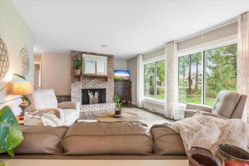 Large picture windows drench this room in warmth and light
