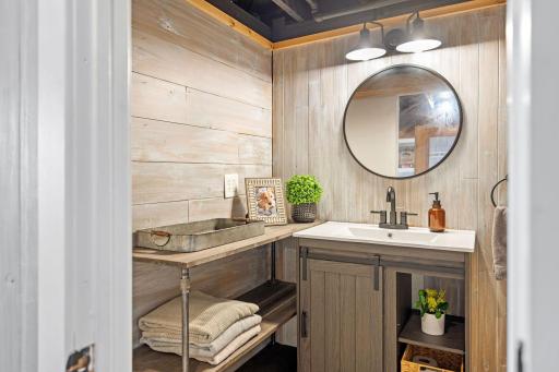Lower level 3/4 bath with walk-in shower and additional stoa