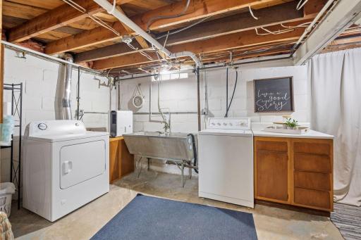 Bright and clean lower level laundry room makes this chore a breeze!