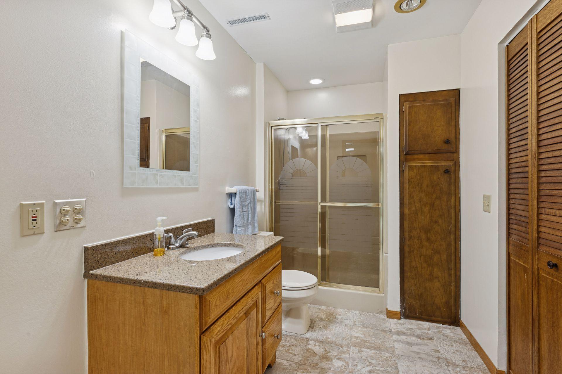 Lower level 3/4 bath with brand vinyl flooring.