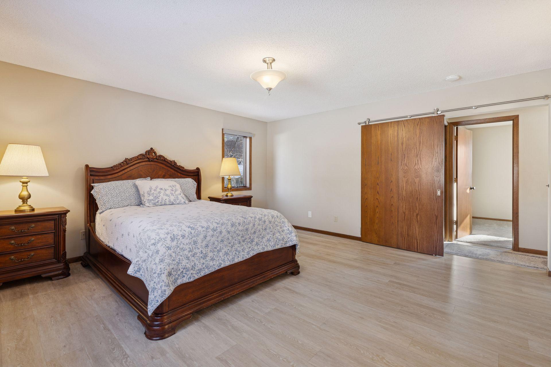 Main floor owners suite is wheelchair accessible with sliding barn door.