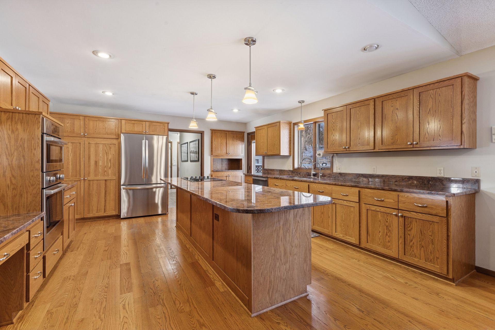 Plus, new LG refrigerator in 2025. Next to refrigerator is the pantry with pull out drawers.