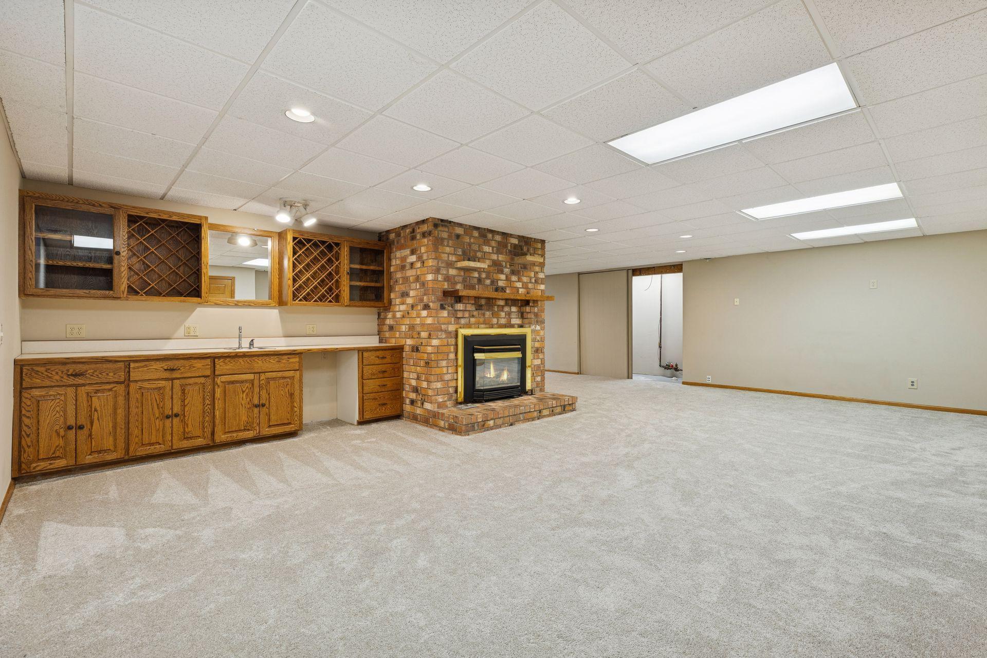 Wet bar with awesome cabinet and counter space. And a gas fireplace!