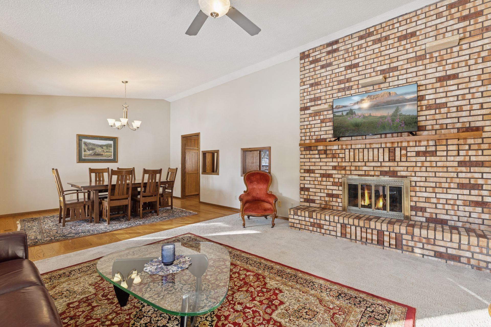 The home offers a stunning original floor to ceiling, 2 sided, brick gas fireplace.