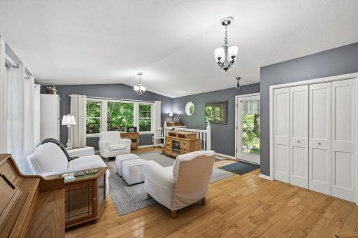 Truly a Hidden Gem! Main level living room with gorgeous windows and views of privacy and wildlife!