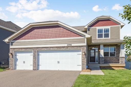 Beautifully maintained two-story home with charming front porch and modern curb appeal.
