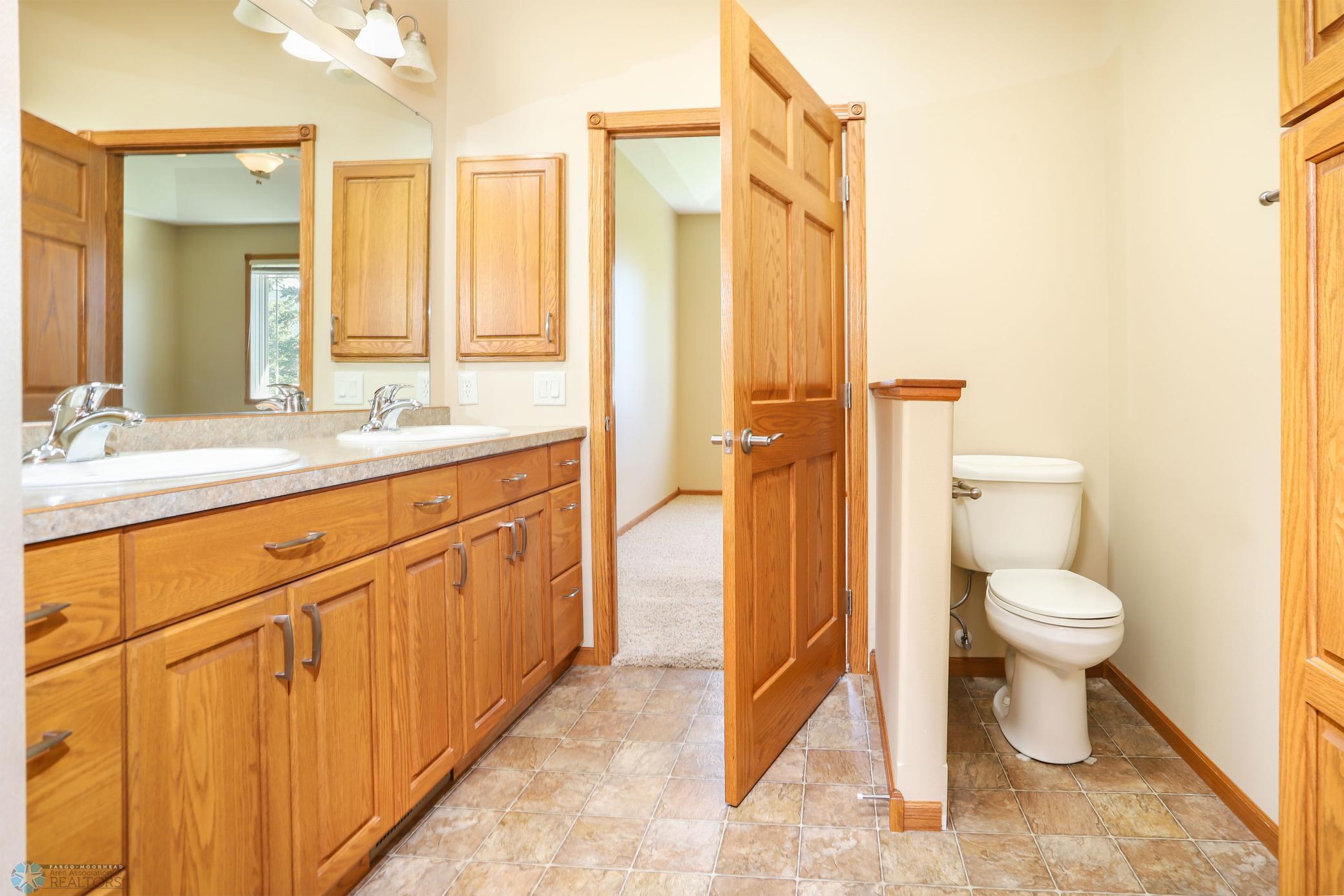 primary bath view to bedroom