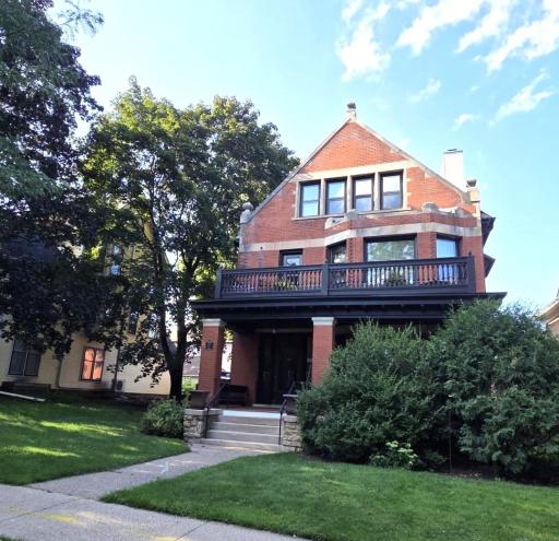 This stately brick home has new composite decking on main floor porch, which is exclusive for this unit.