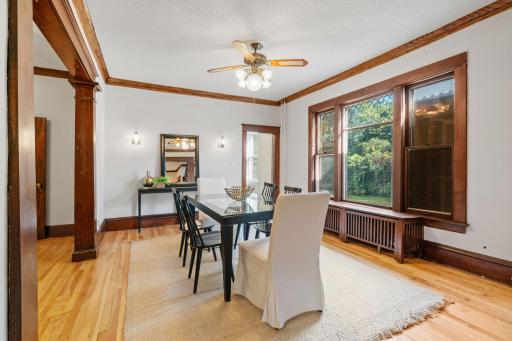 Formal dining room with huge arches to parlor and living room.